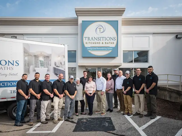 The Transitions Kitchens, Baths and Remodeling team in front of the Norwell showroom and a company truck