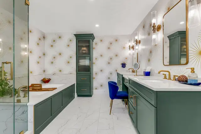 Hingham, MA primary bath with an emerald green double vanity, gold starburst wallpaper and brass fixtures